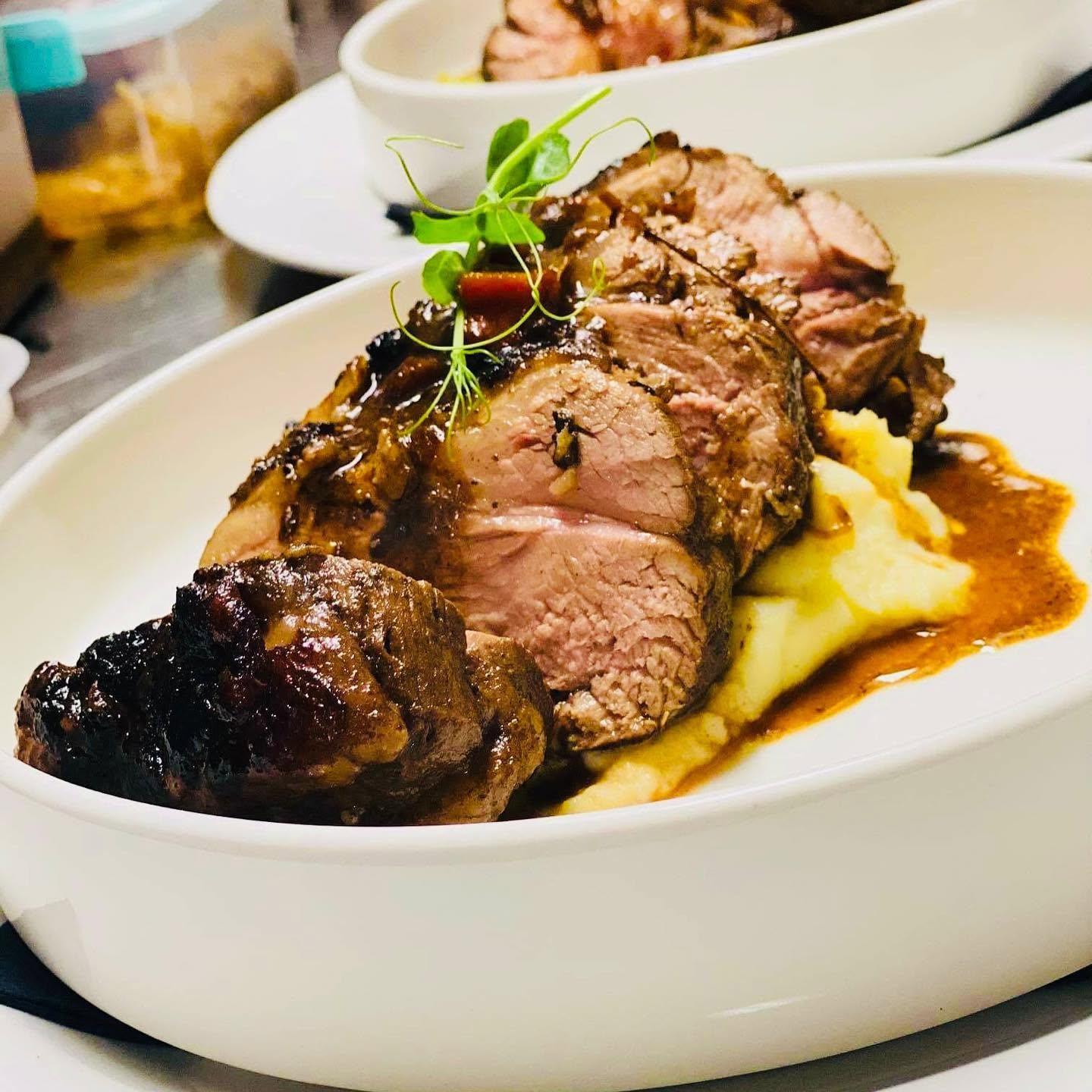 Gourmet roasted meat served with potato puree and rich jus